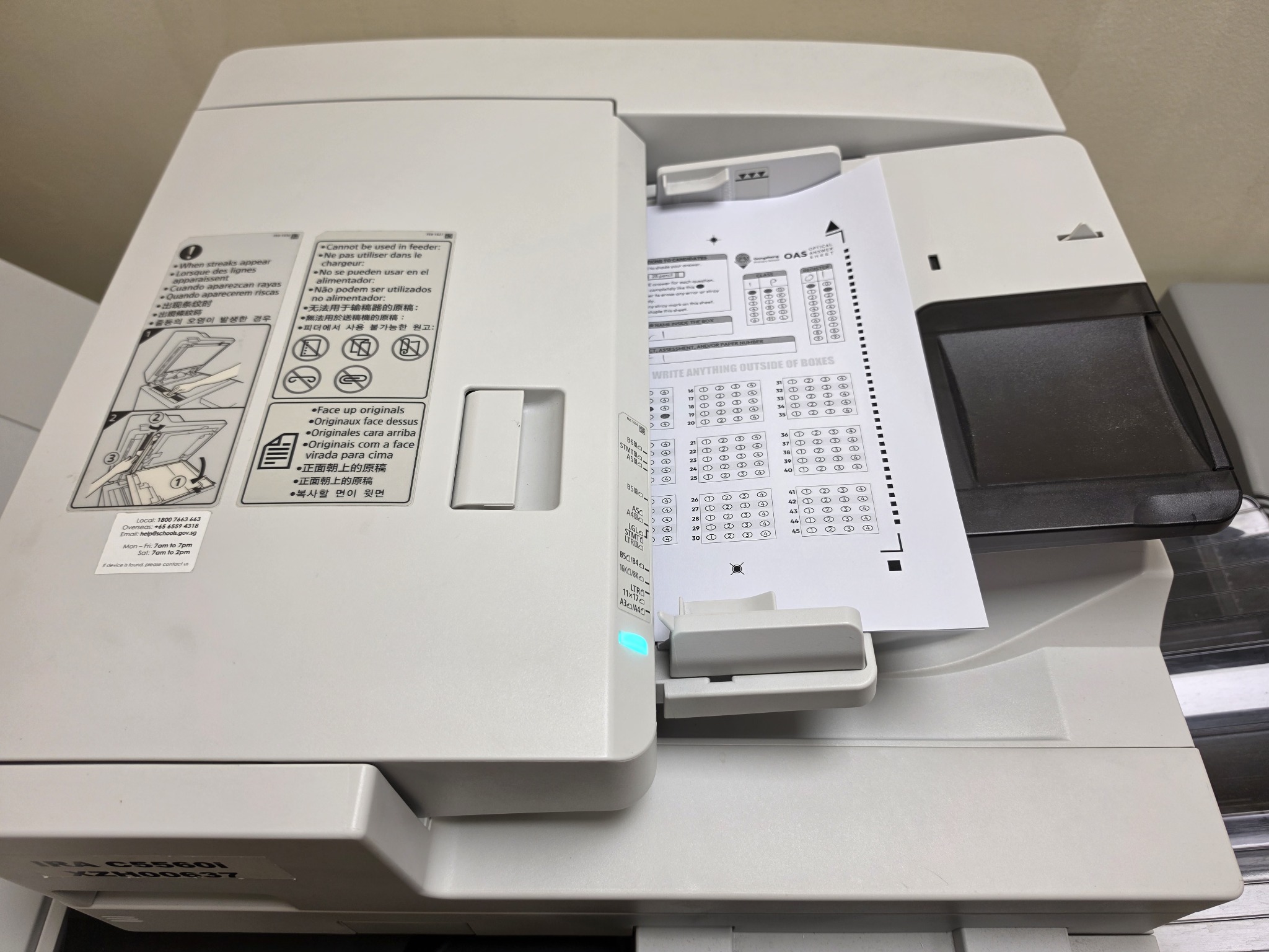 Response sheet loaded face up between the ADF paper guides
